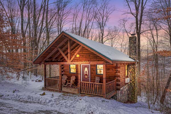 Front view of the cabin and stone chimney