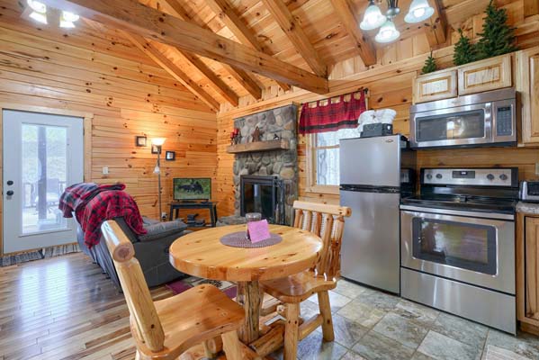 Small dining table with the kitchen behind