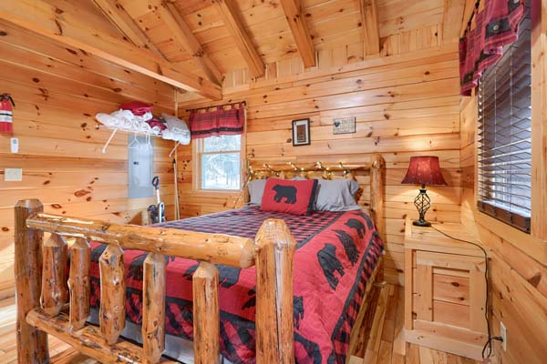 Bedroom area with nightstand and red lampshade