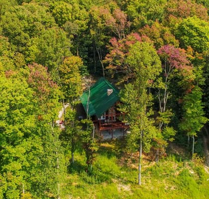 Aerial view of the cabin among the trees