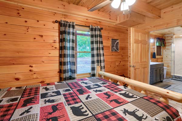 Bedroom with log furniture and window