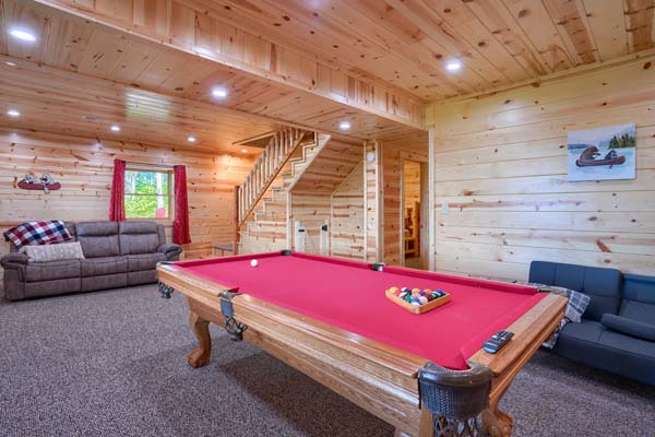 Game room with sofa and television