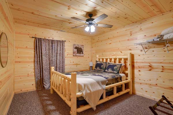 Bedroom with cabin themed bedding