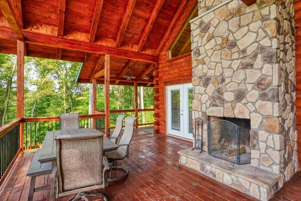 Outdoor stone fireplace on the deck