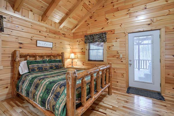 Log bed with green patterned covers