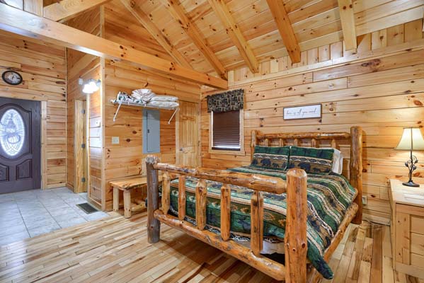 Sleeping area showing the high wood ceiling