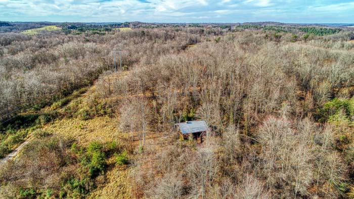 Aerial view of the wooded property