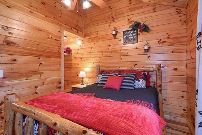Bedroom with window and log furniture
