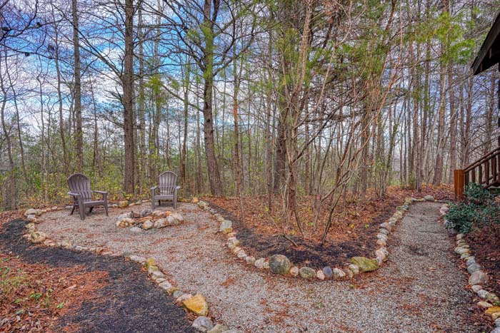 Fire pit gathering area beside the cabin