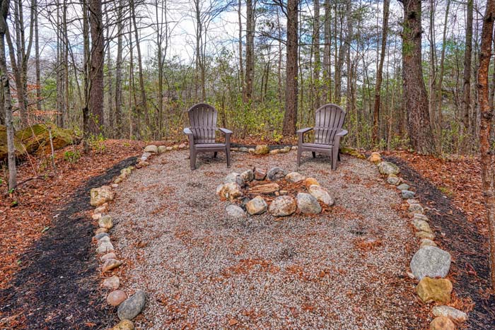 Stone ringed fire pit in the woods