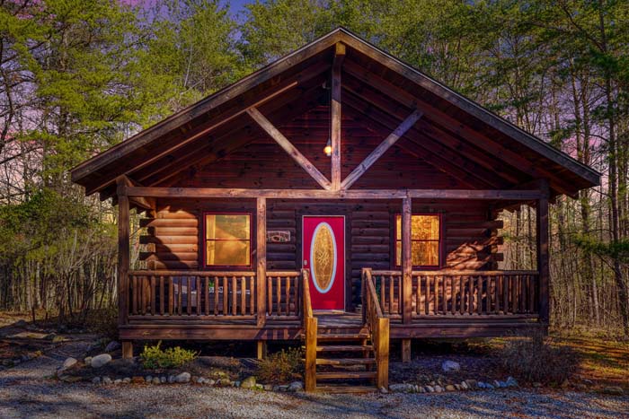 The Sugar Bear Cabin with a red front door