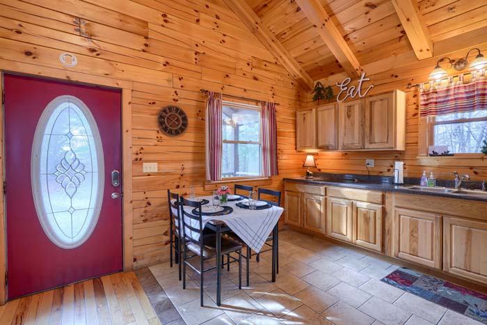 Kitchen with dining table and appliances