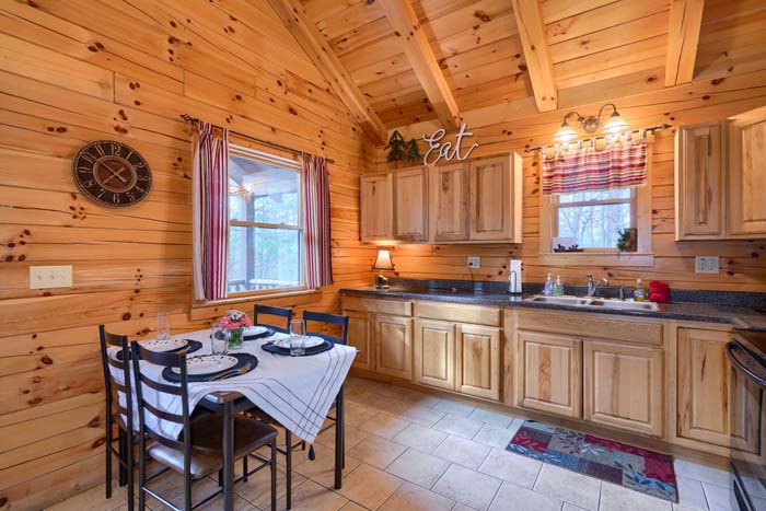 Kitchen with range, microwave and sink